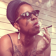 The author enjoys a summer smoke on her back porch.